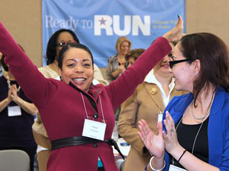 Women celebrate at the ready to run event.