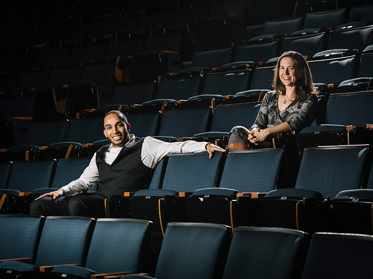 Sam Figueroa and Dr. Amy Levad pose in an auditorium.