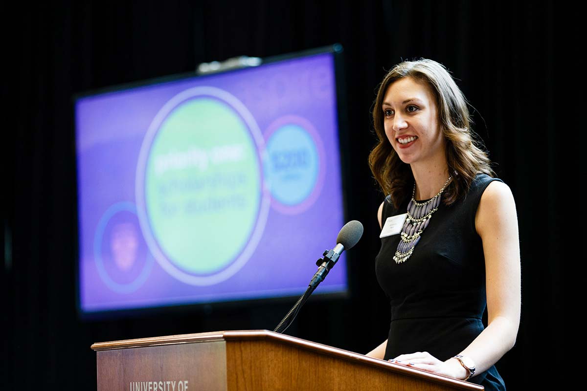 Alumna Amanda Post speaks at a scholarship presentation.