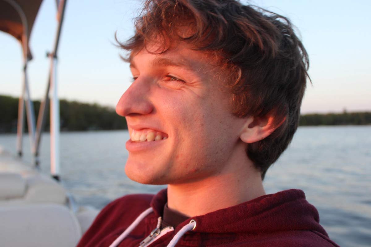 Brennan Schaffner at sunset on a boat.