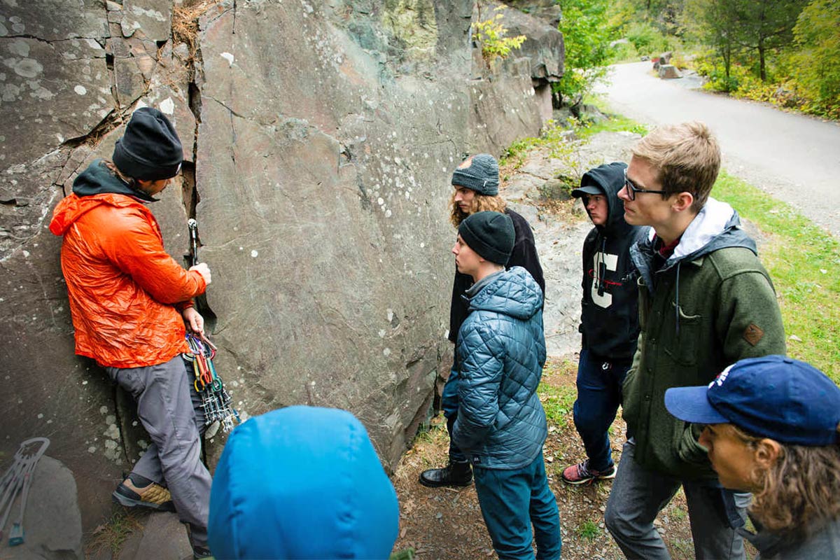 Geology students examine a rock face in Taylors Falls, Wisconsin. 