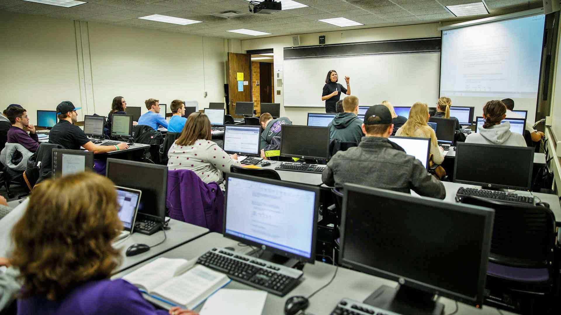 Economics Professor Luz Saavedra teaches an Economics Forecasting class in an O’Shaughnessy Education Center classroom.