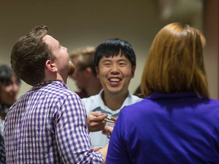 Students mingle with economics faculty at the annual Chili Fest.