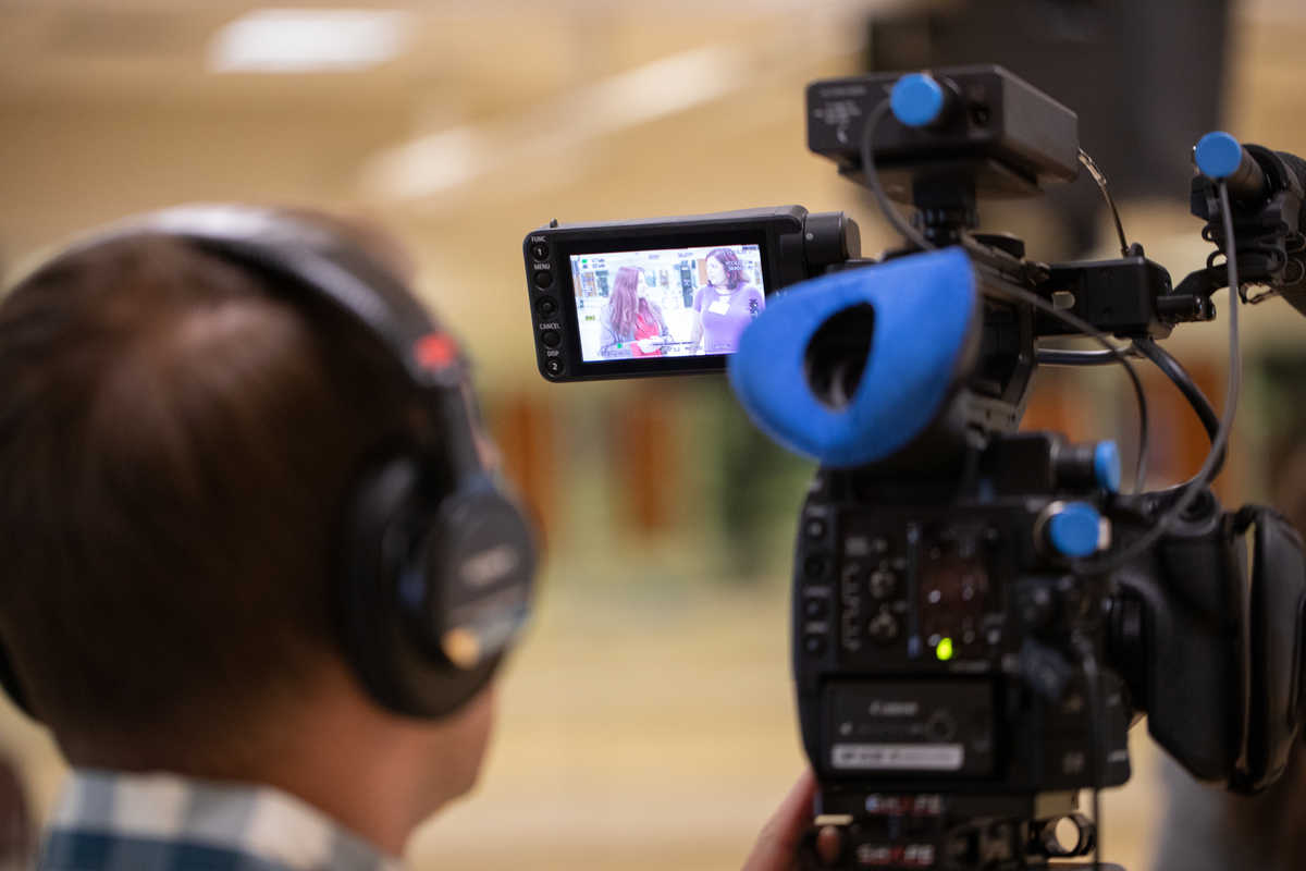 A ThreeSixty Journalism student works a video camera during the annual summer camp.