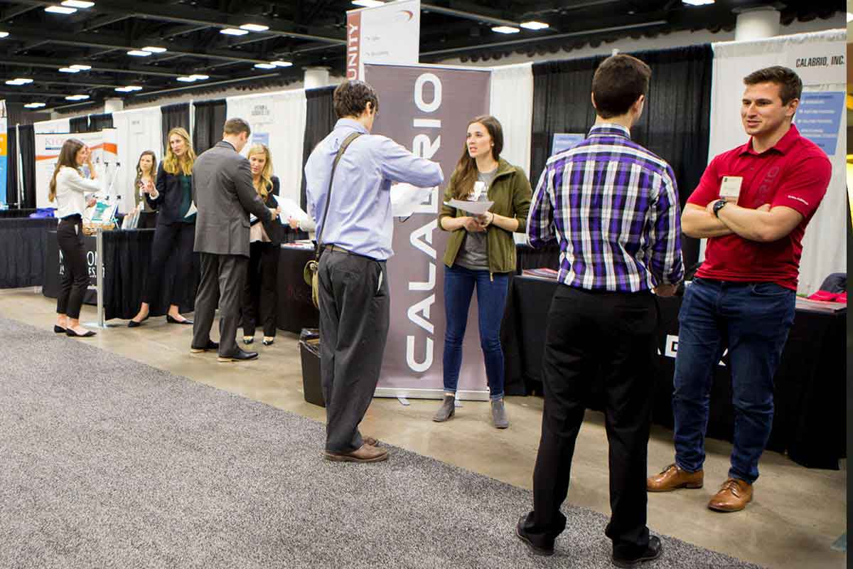 Students speak with recruiters at the Minnesota Private College Job Fair. 