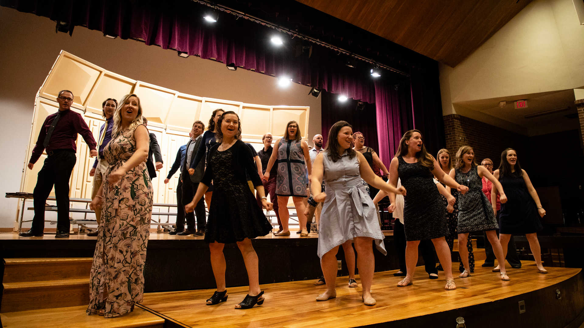 Students sing during a graduate choral concert.