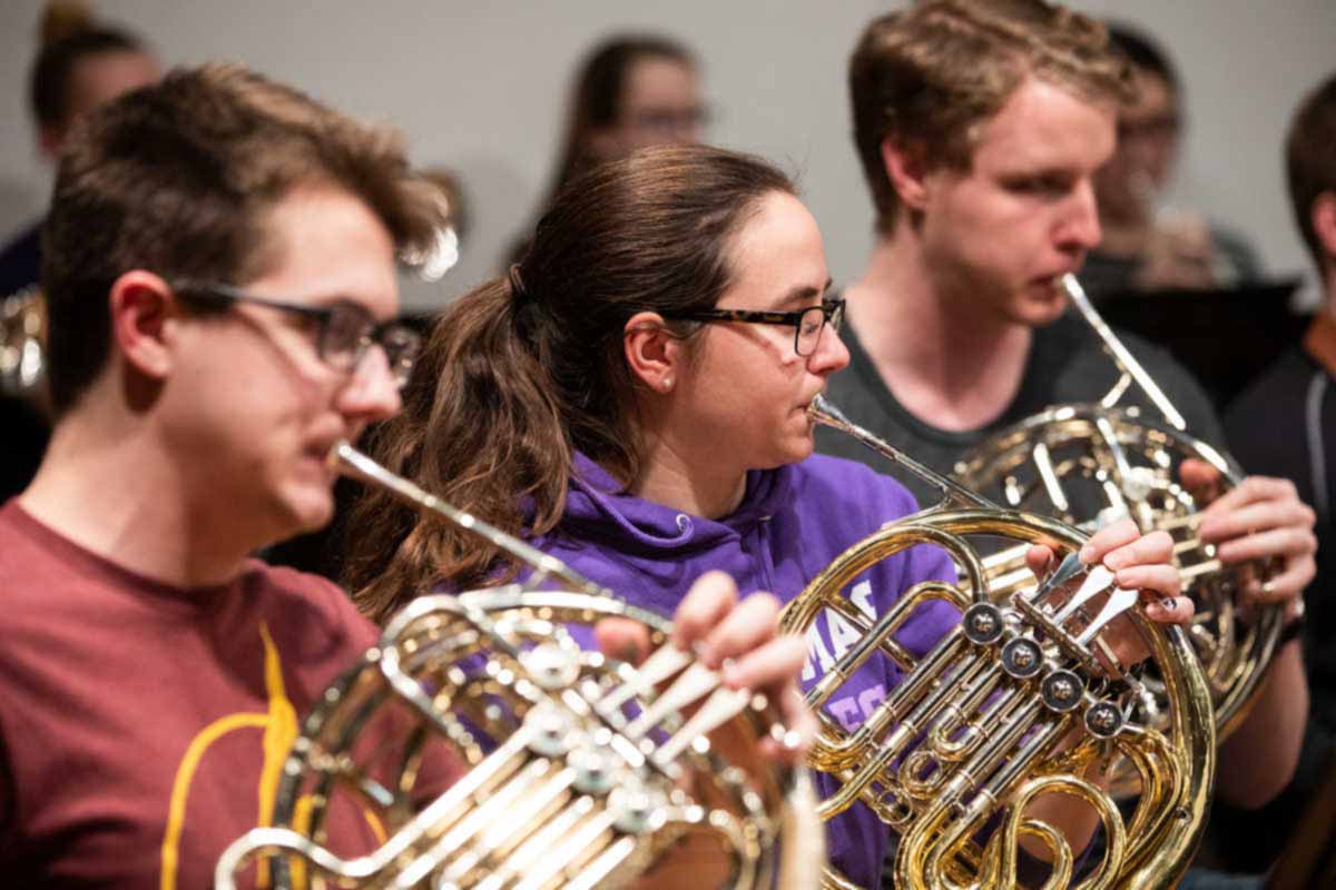 French horn players rehearse during Symphonic Band class.