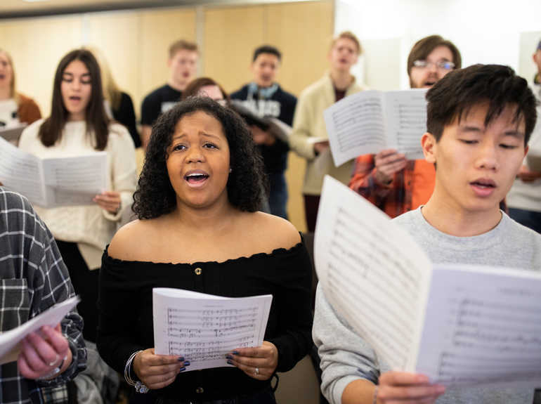 Choral students rehearsing during class.