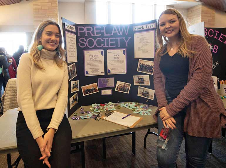 Students from Pre-Law Society pose for a photo at the Spring Activities Fair. 