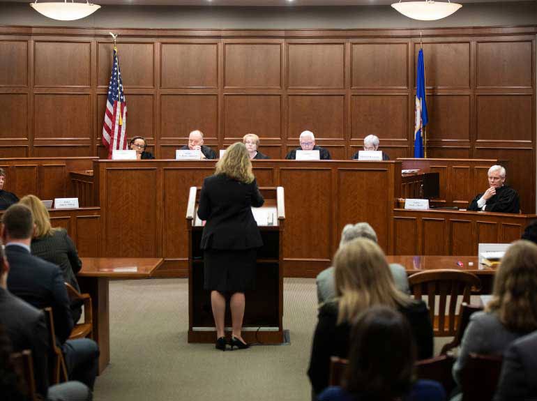 Justices listen to arguments during a visit to the Frey-Moot Courtroom in Minneapolis.