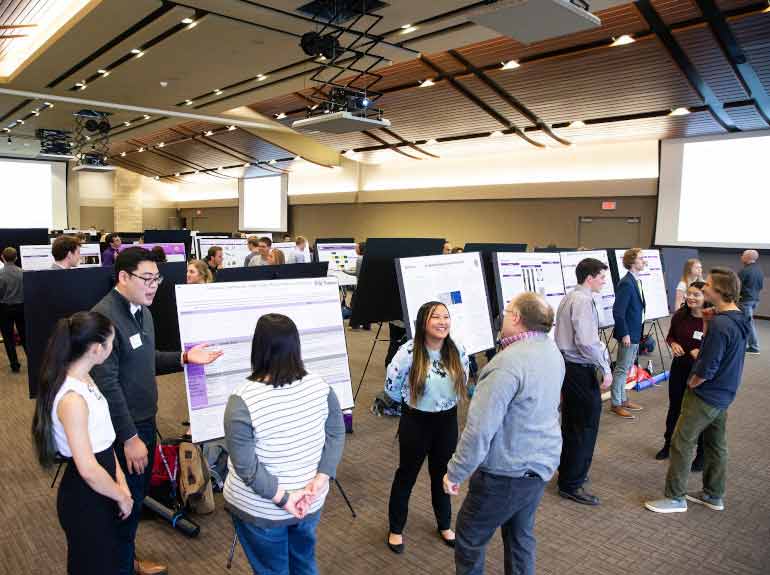 Students present their research findings during the Undergraduate Research Poster Session. 
