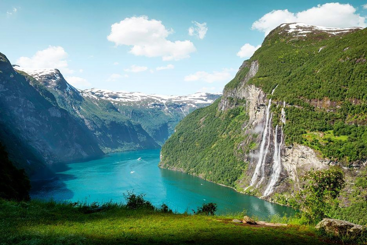 The iconic Geirangerfjord in Norway, a UNESCO World Heritage site known for its dramatic landscapes
