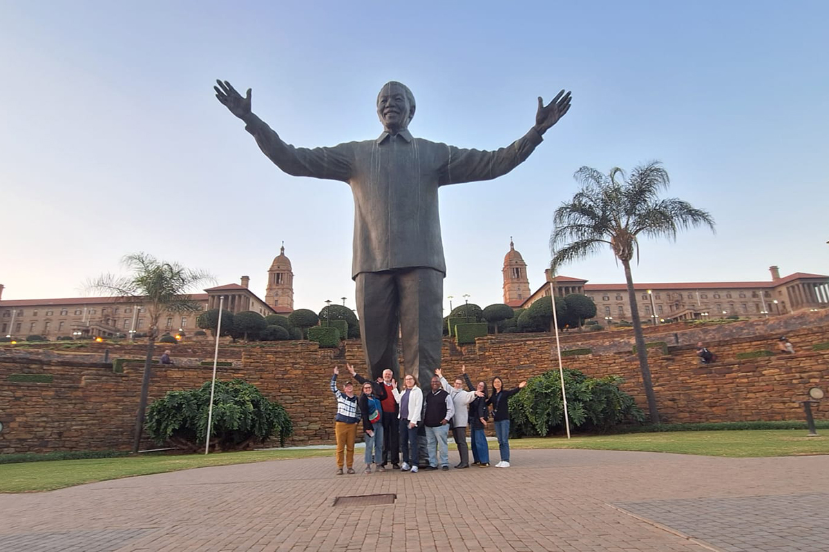 Faculty in front of the Nelson Mandela at the Union Buildings in Pretoria, South Africa