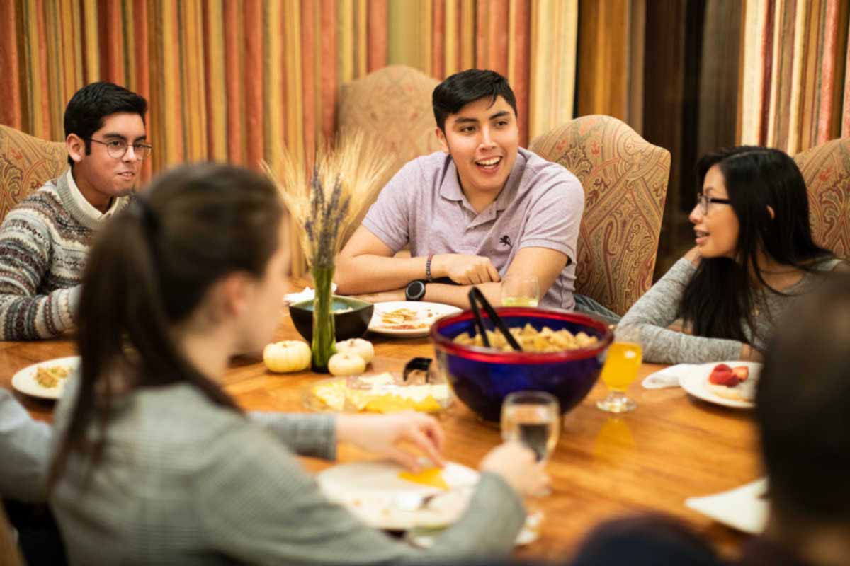 Members of the Guadalupe's Scholars Program gather for communal dinner