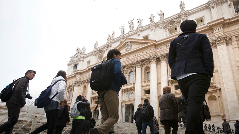 Students walk to a church in Rome