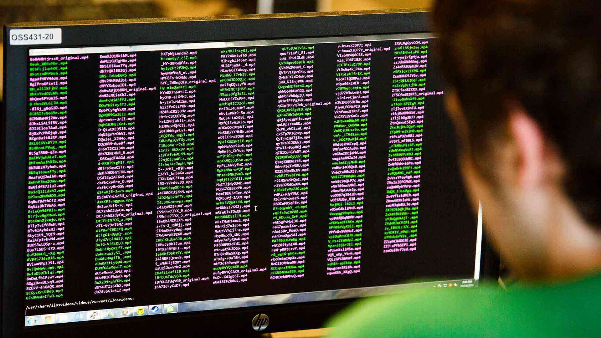 A student looks at a screen filled with code during a computer science class.