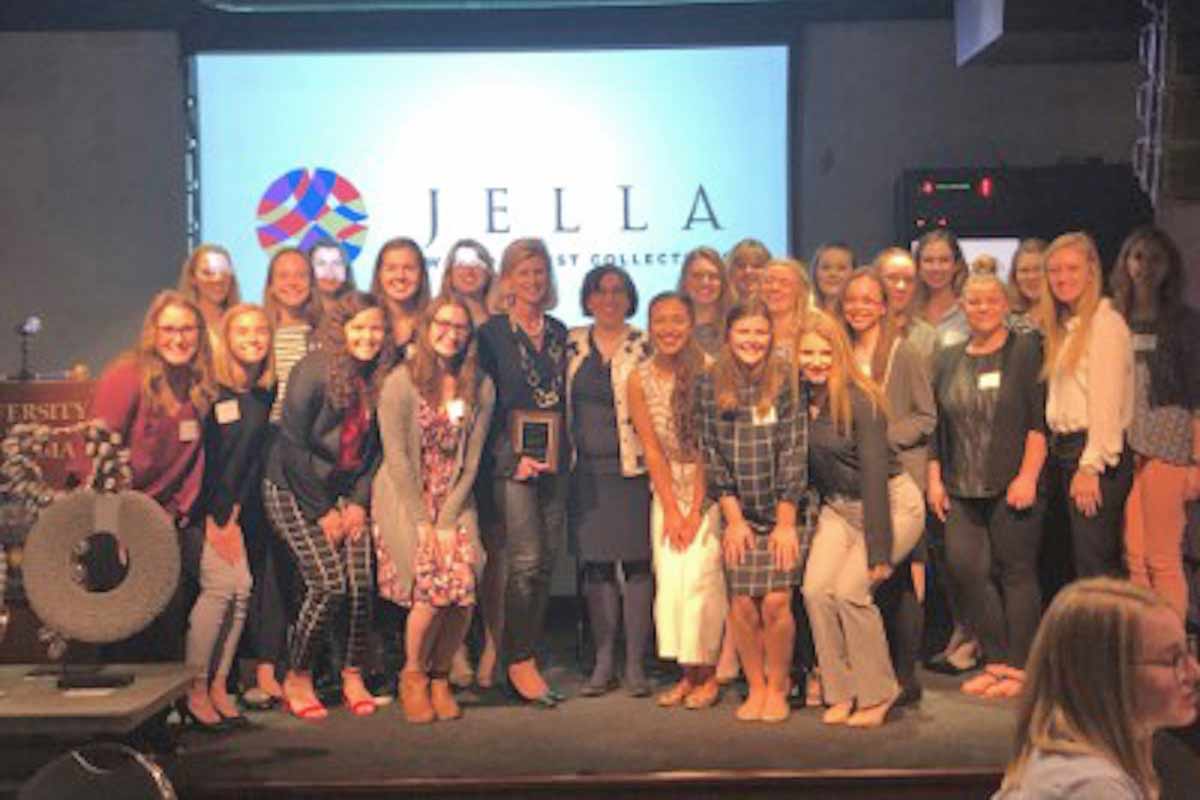 A group of female students pose for a photo at the Titan Series event with Dr. Monica Hartmann and the guest speaker Jennifer Kinkead.