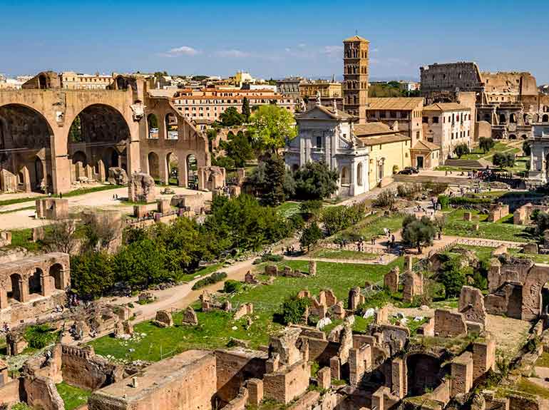 A view of the Roman Forum in Rome Italy on a sunny day. 