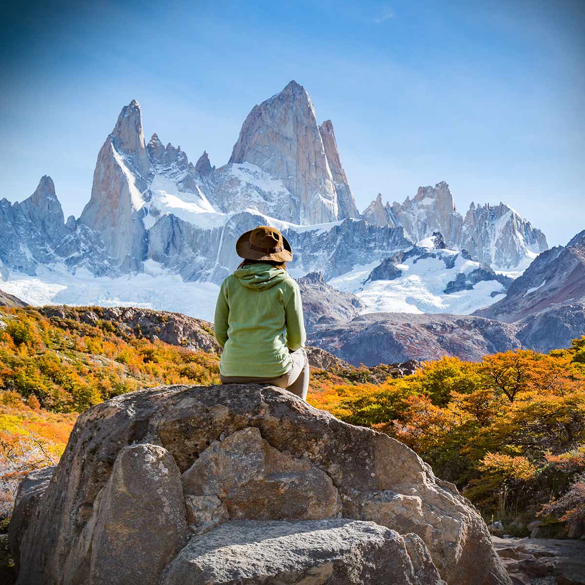 Woman sitting on stone in Patagonia, Argentina