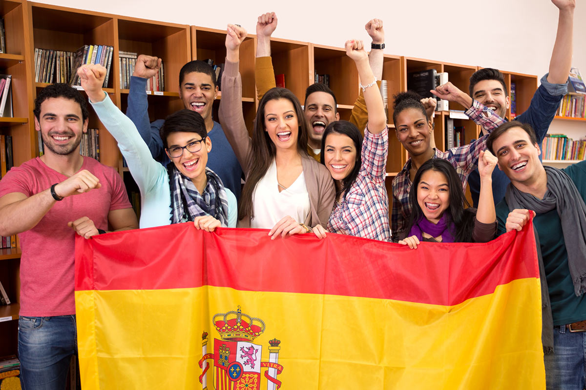 Groups of students holding flag of Spain