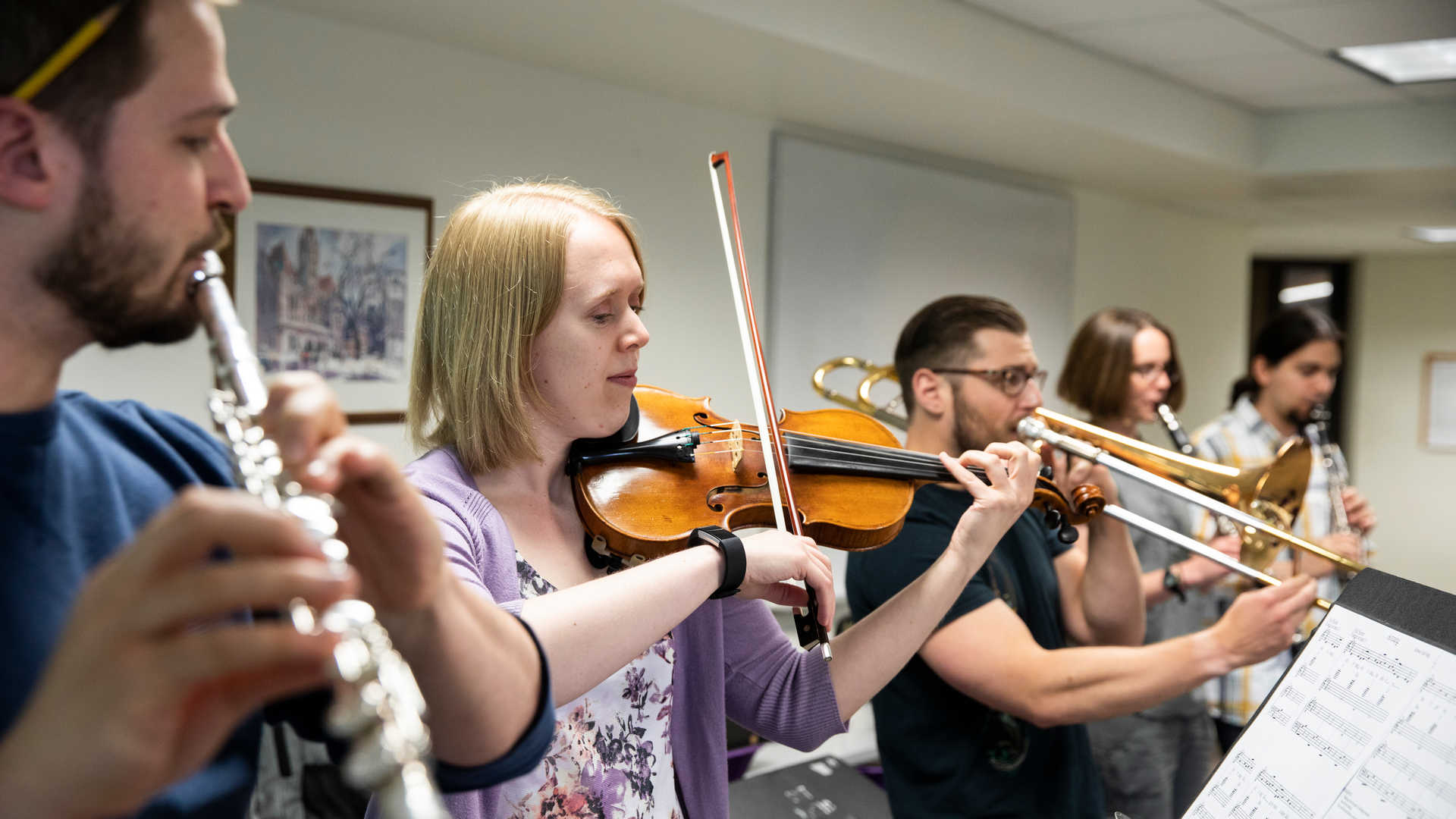 Students play instruments during a class.
