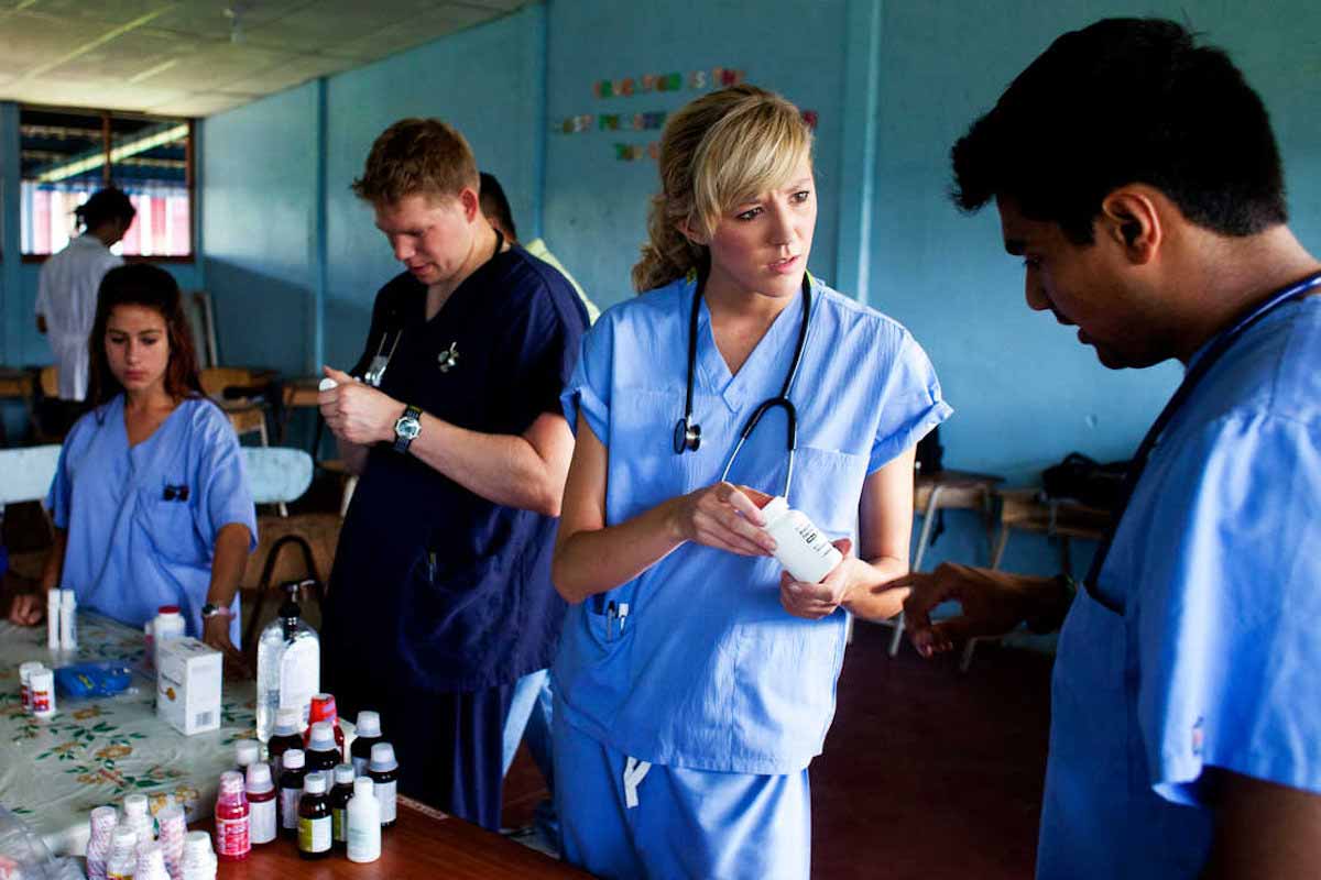 A St. Thomas student helps organize a pharmacy at a temporary free clinic in Costa Rica. 