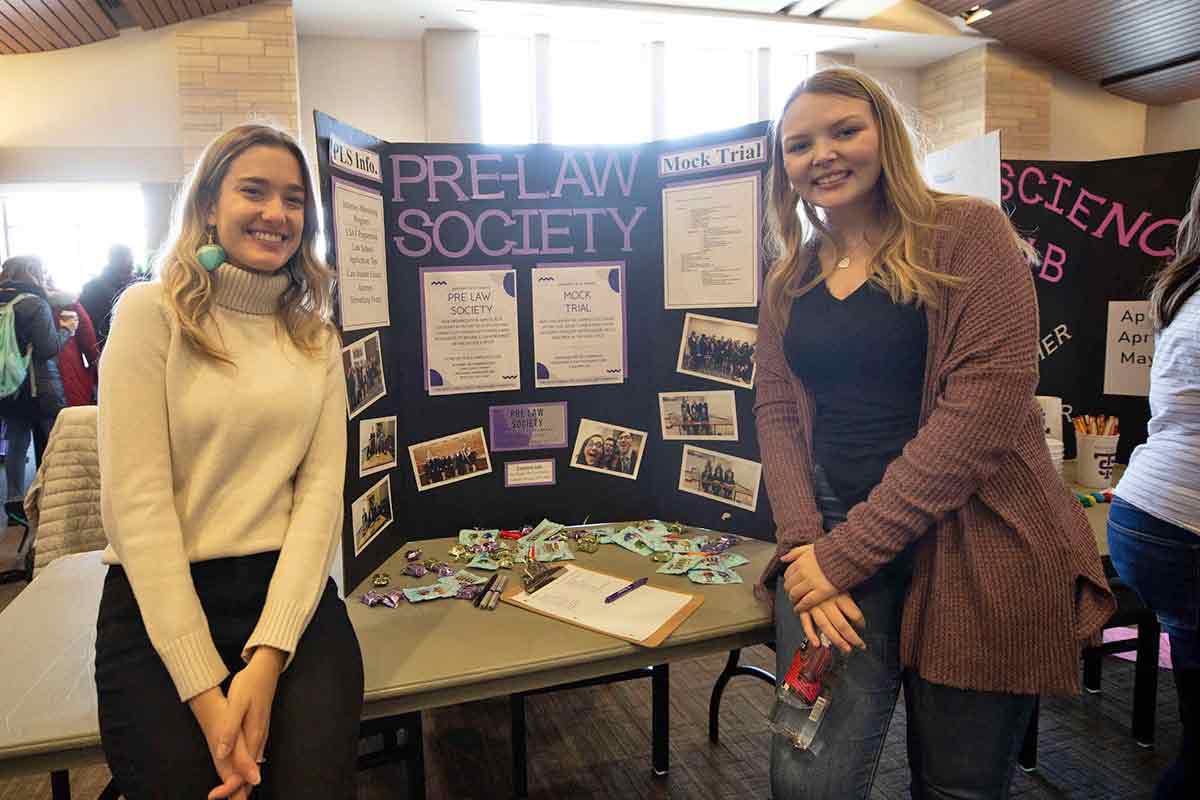 Students from Pre-Law Society pose for a photo at the Spring Activities Fair.