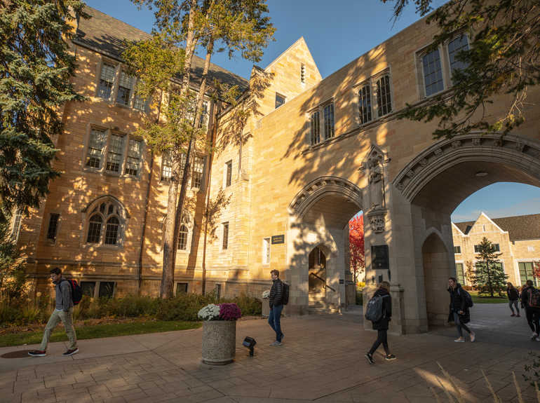 students walking on the St. Paul campus